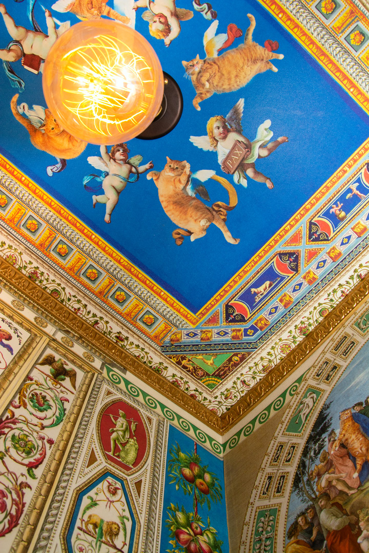 Cats and angels at the ceiling fresco of the secret room in the Vatican museum